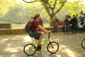 bicycling man in a park