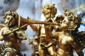 golden angel statuettes