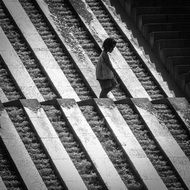 black and white photo of a child on the water in Paris