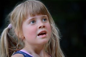 cute blond girl with two ponytails