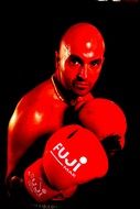bald boxer in red