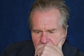 portrait of man face closeup head eyes hand
