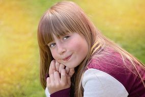 portrait of a beautiful girl in a meadow