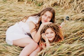 beautiful girls in the dry grass