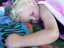 Sleeping child on the towel