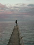 man on the bridge at the baltic sea