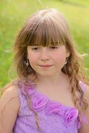 blond girl portrait in the meadow