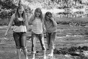 photo of three girlfriends in the marshland