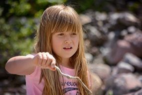 little blond girl playing