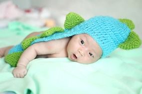 newborn in knitted clothes