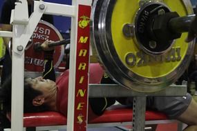 bodybuilder is doing bench press