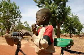 local baby in africa by bike