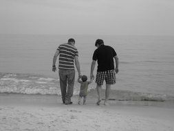 family on beach monochrome photo