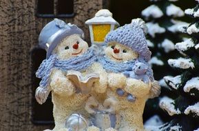 happy snowman couple figurine