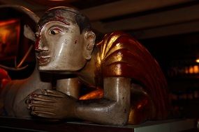 praying person, colorful statue