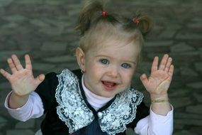 baby girl with blue eyes looking out the window