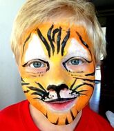 child with body art on the face