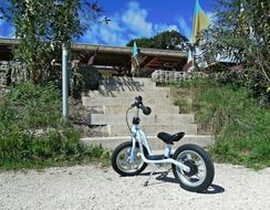 child s bike stairs emergence