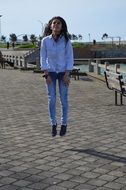 young girl jumping in park