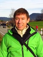 man in green jacket portrait