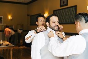 elegant groom with friends