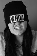 girl in a hat with the words 