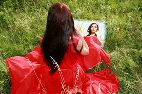 Reflection of the girl in the mirror
