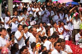 crowd of praying buddhists