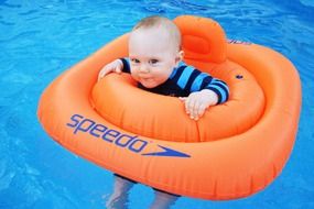 child in a red buoy