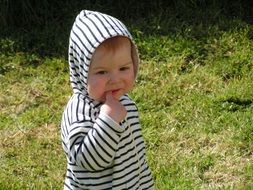 baby on green grass