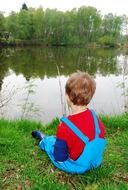 child boy fishing at pond