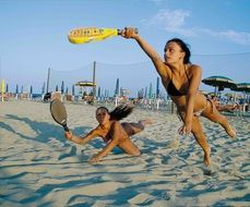 beach games, girls with rackets in motion