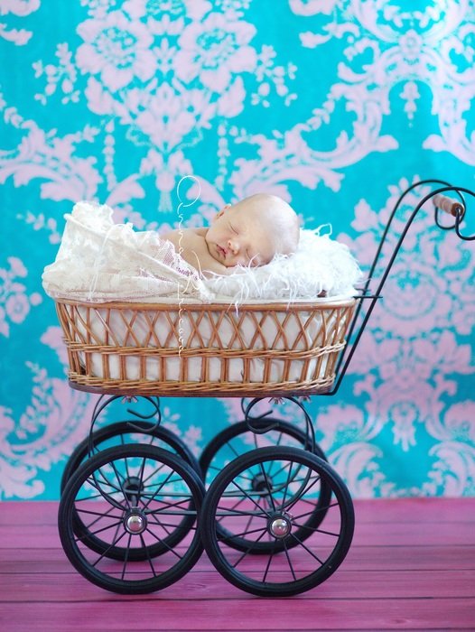 photo of baby in wicker stroller