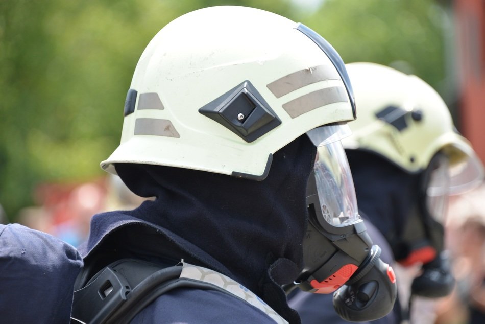 firefighters in helmets and masks