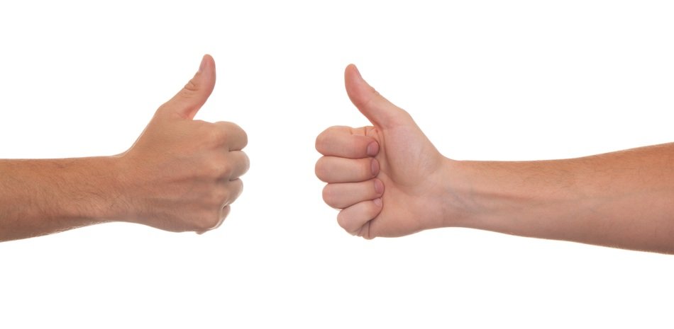 thumb hands at background of white wall