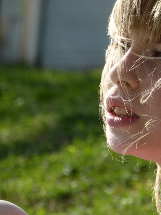 Portrait of blonde child girl at the sunlight