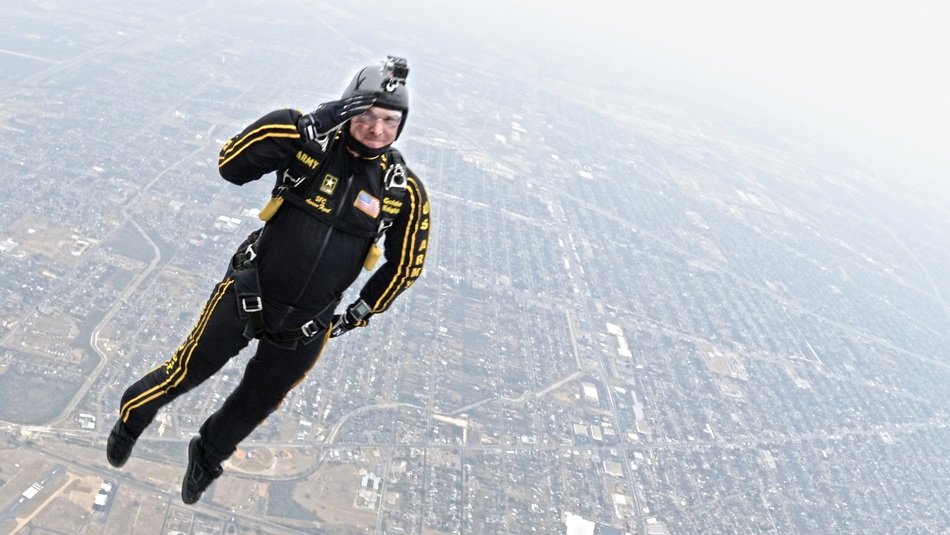parachutist in flight over the ground