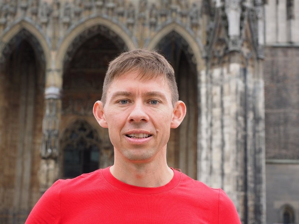 man with flexible ears on the background of the building