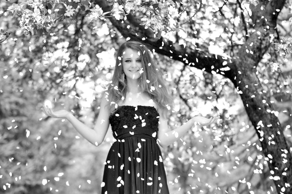 beautiful young girl in the garden in black and white image