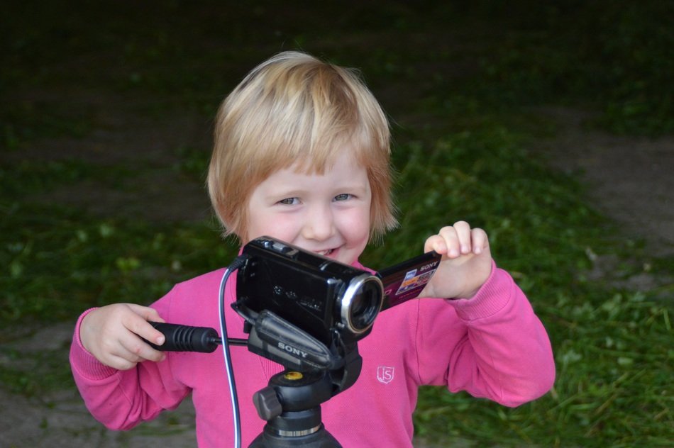 Little girl near the camcorder