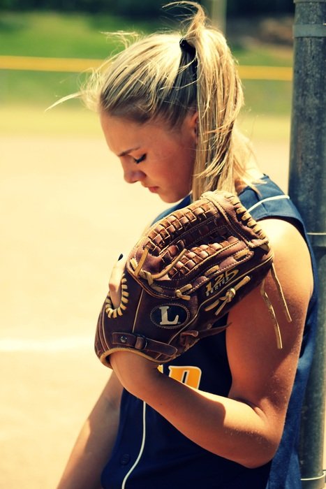 blond girl playing softball