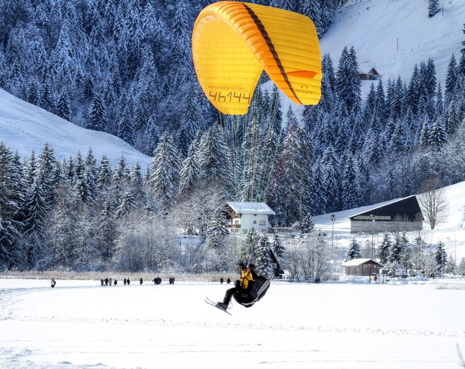 paragliding air sport winter day mountains