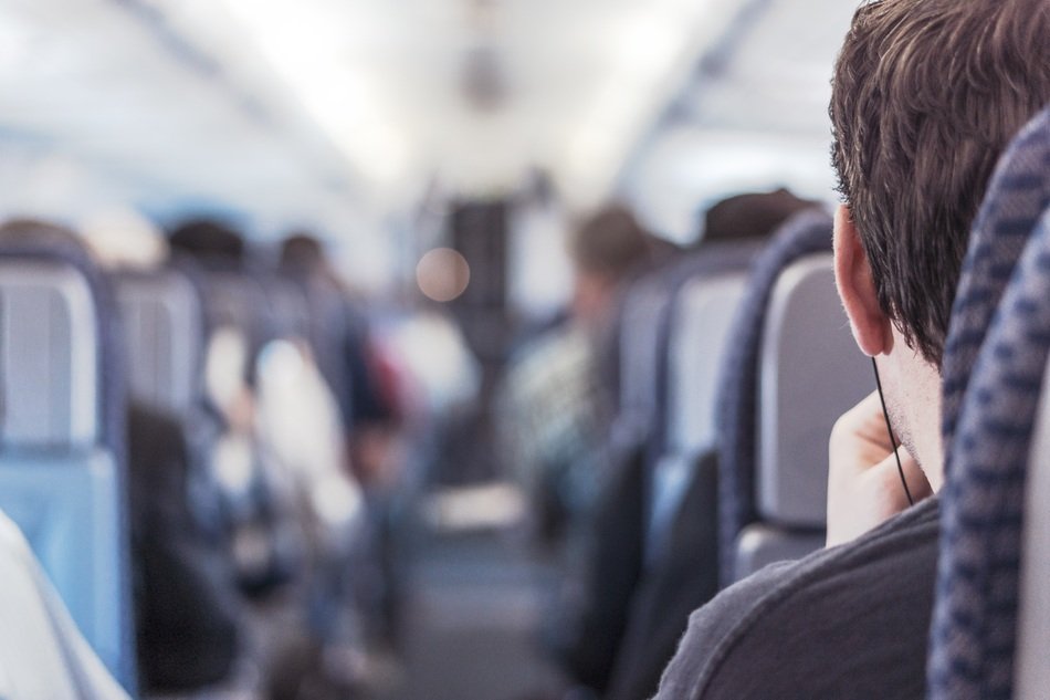 passenger on seat, back view