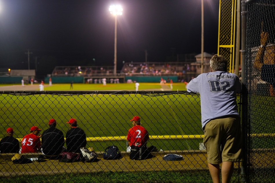 people at the sports stadium in the evening