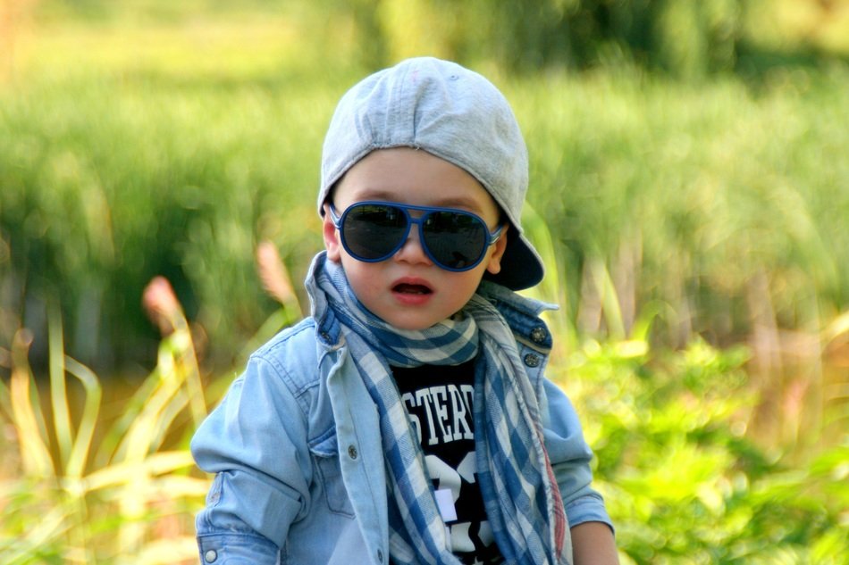 Portrait of a child in sunglasses on the street