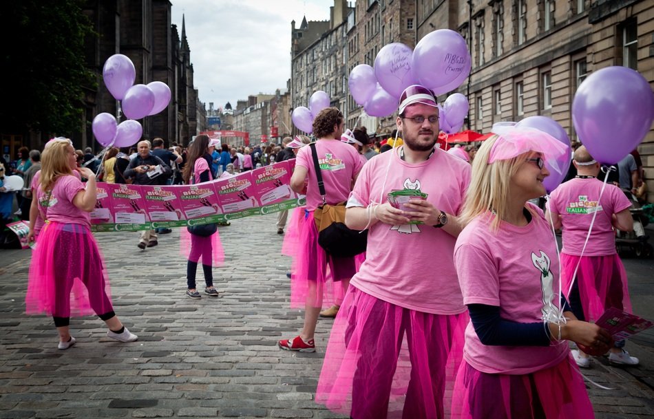 street performers in pink costumes