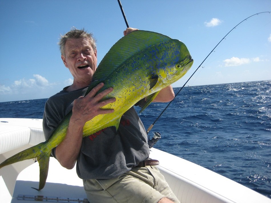 dolphinfish, mahi-mahi in happy fishermanâs hands