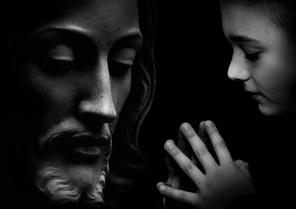 picture of the young boy and statue of god