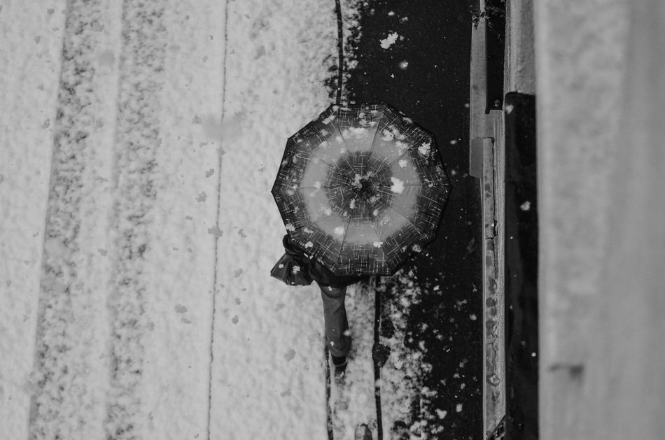 top view of an umbrella on the sidewalk