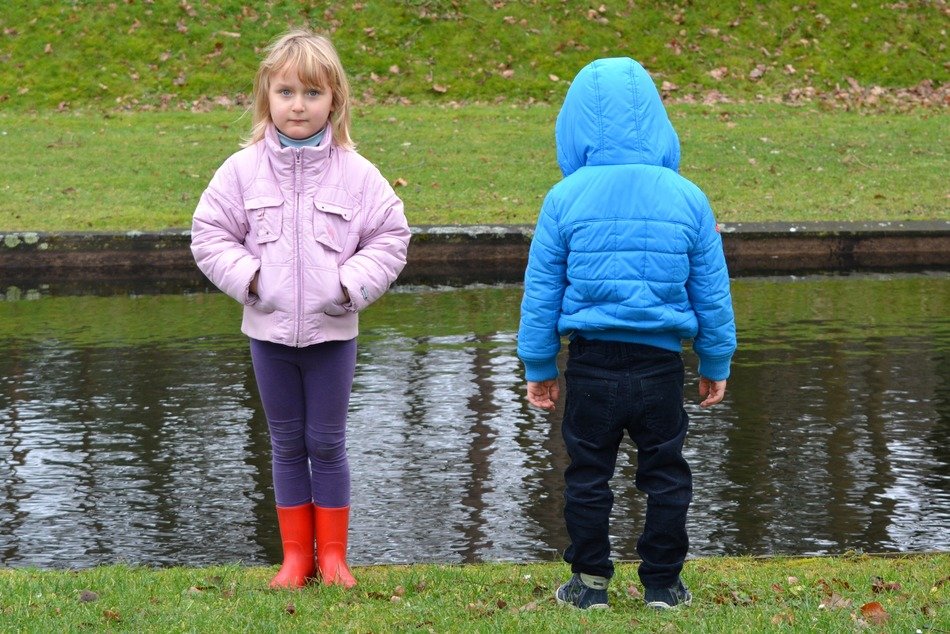 children near the pond